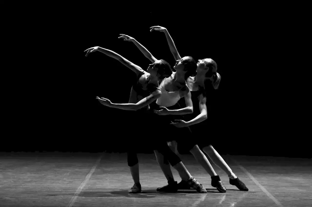 three female dancers dancing