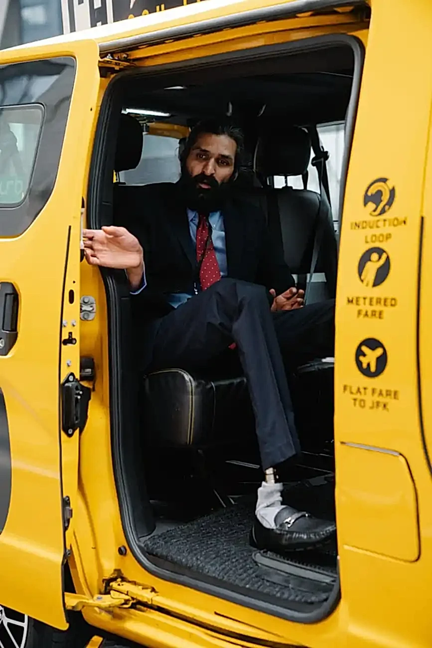 businessman closing the door of the taxi